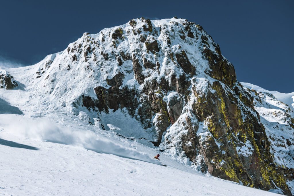 Skier with the Palisades in the background