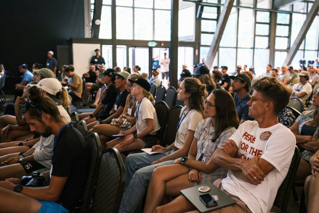 A crowd listens to speakers at TrailCon at Palisades Tahoe.