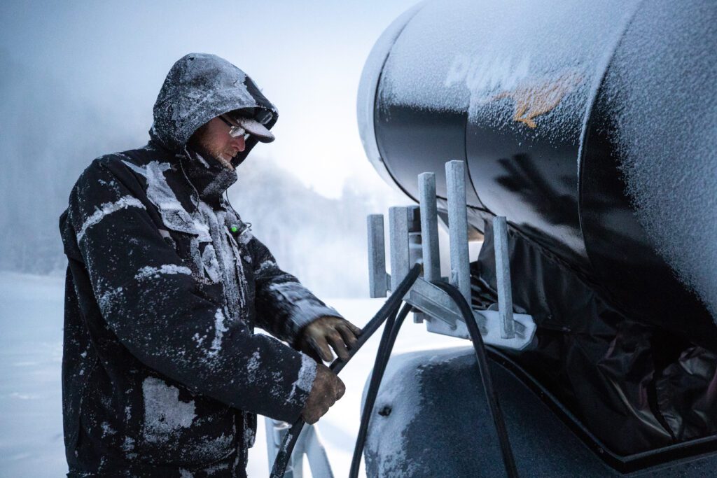 Snowmaking crew member