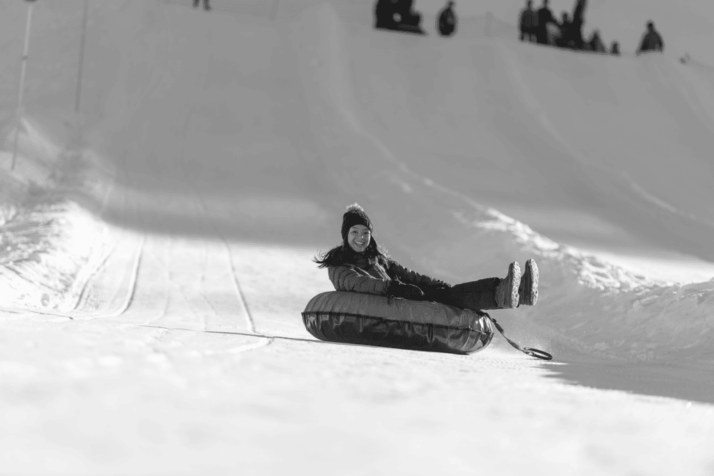 Guest smiling while tubing