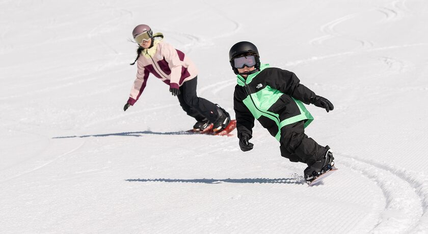 Kids snowboarding at Palisades Tahoe